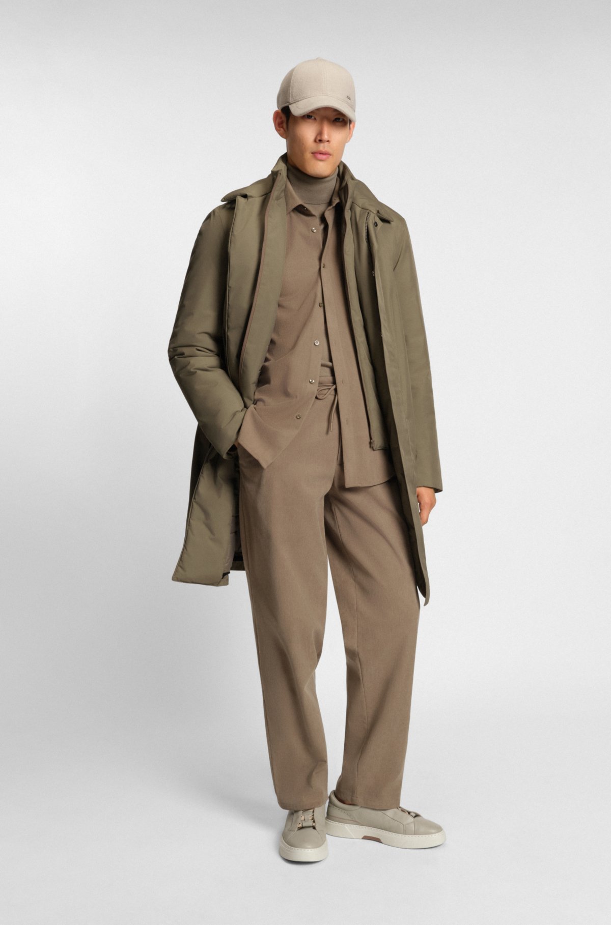 Water-repellent coat with detachable bib
