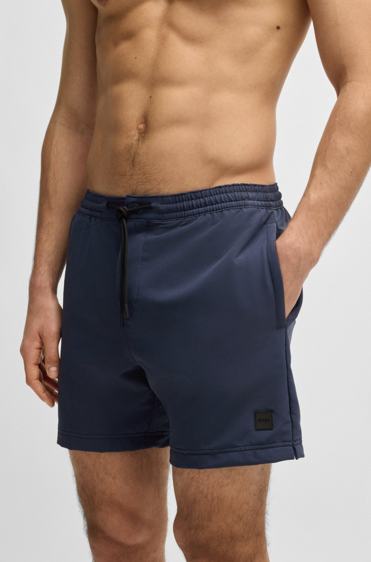 Logo-badge swim shorts with packable construction