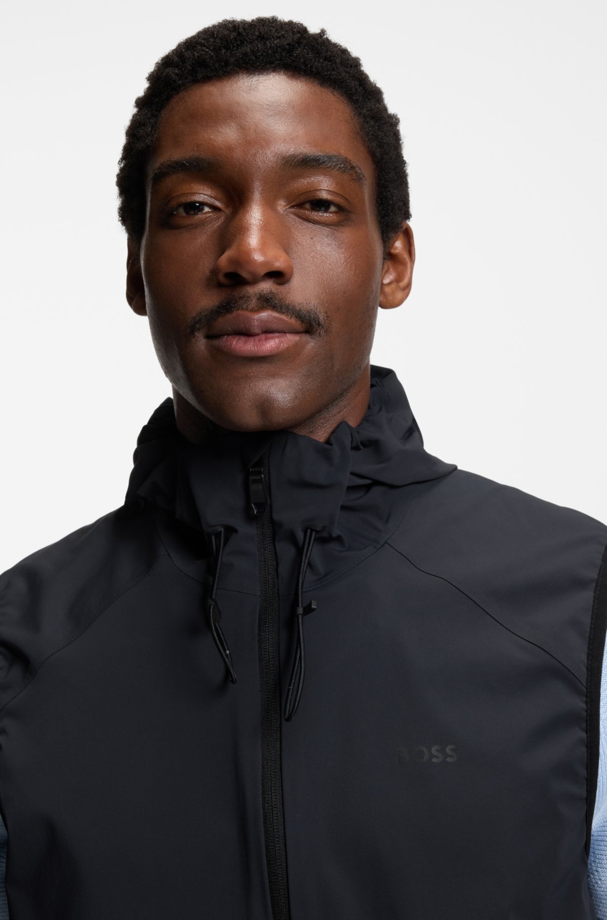 Water-repellent hooded gilet with micro-waffle structure