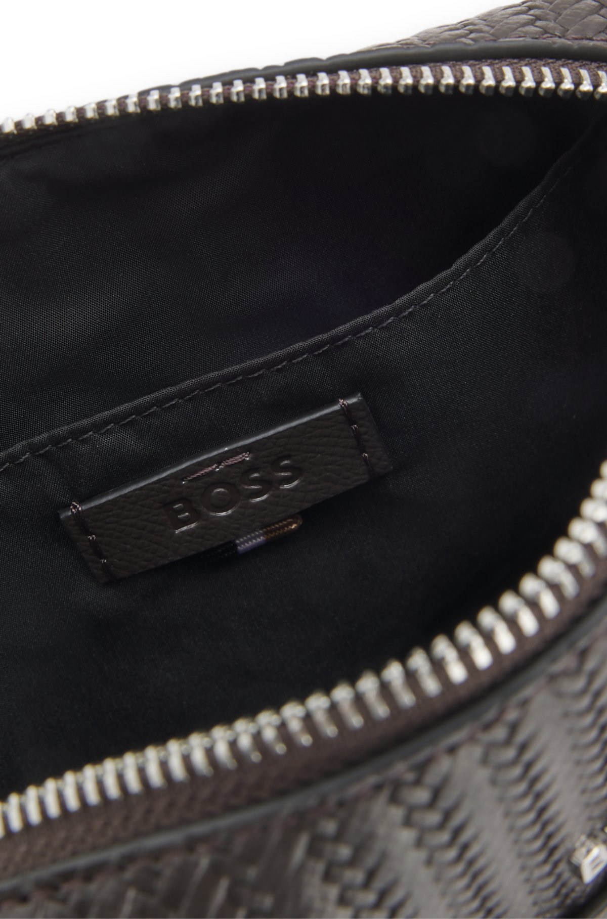 Reporter bag with embossed pattern
