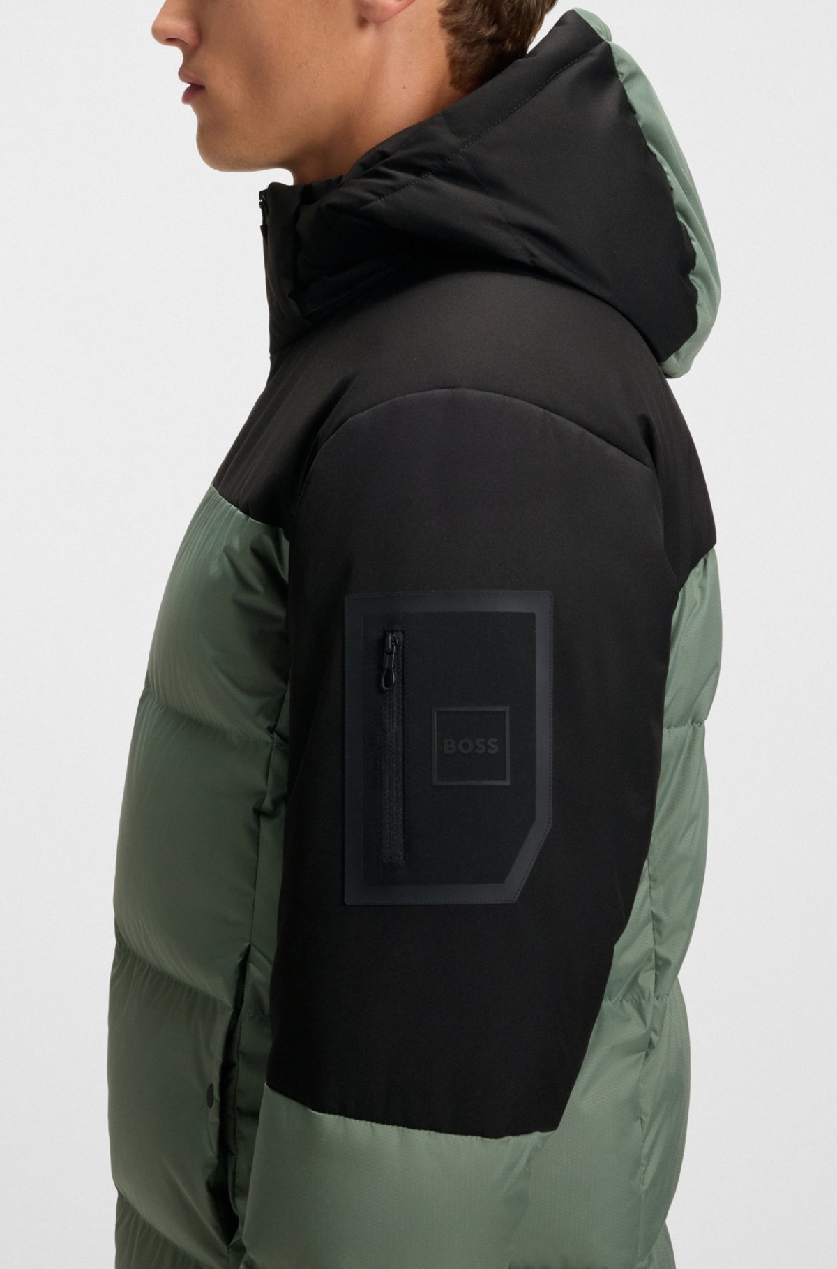 Water-repellent jacket with down filling and detachable hood