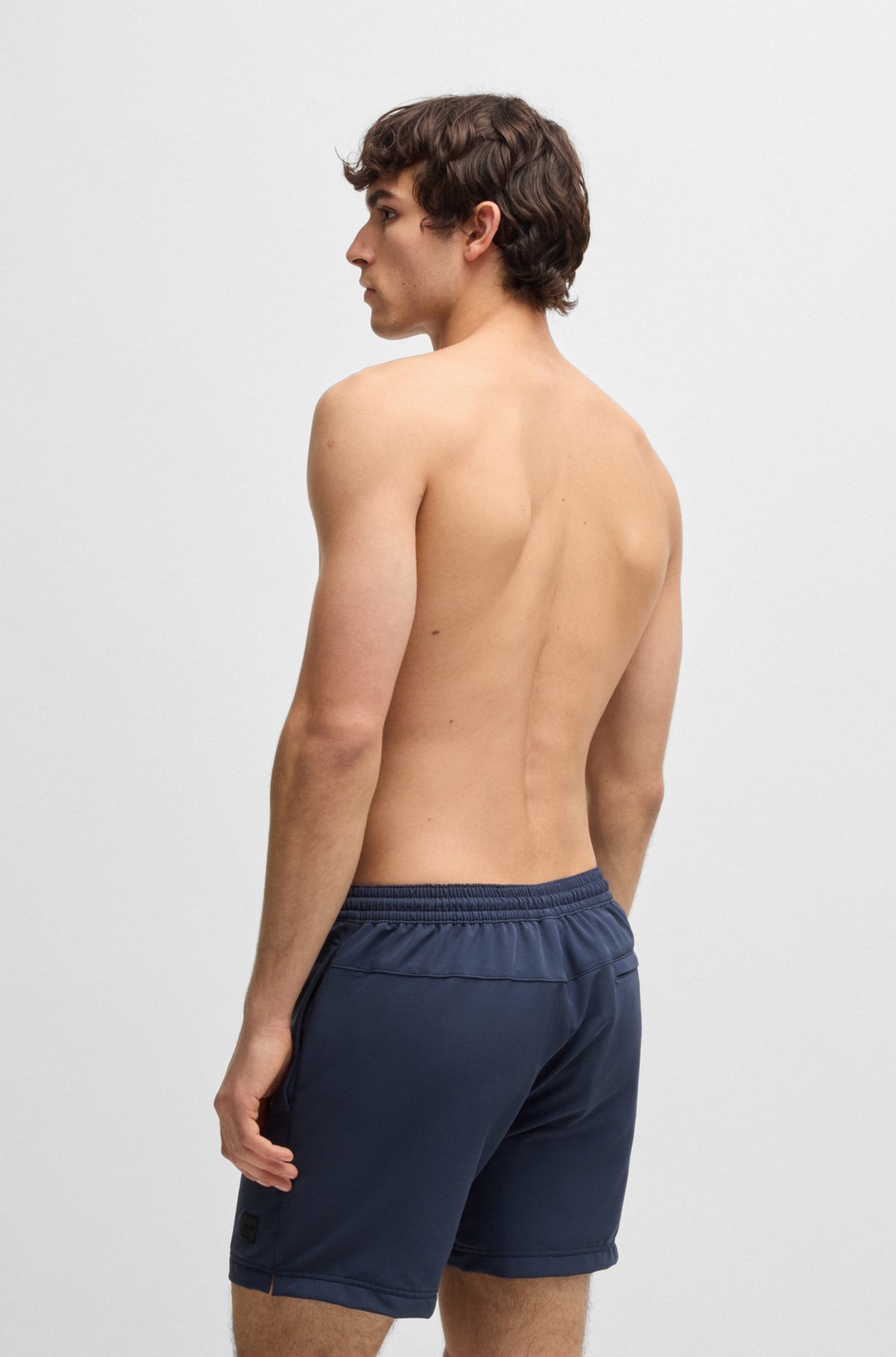 Logo-badge swim shorts with packable construction