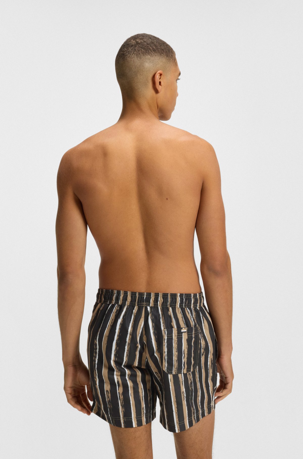 Quick-dry swim shorts with all-over print