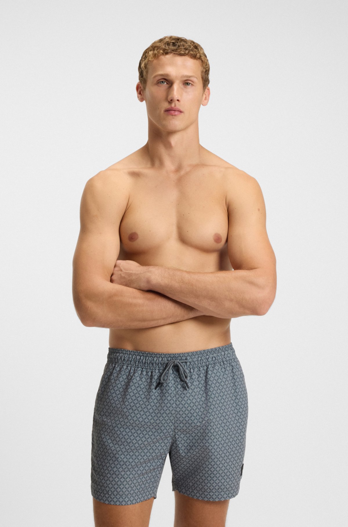 Micro-print swim trunks with logo patch