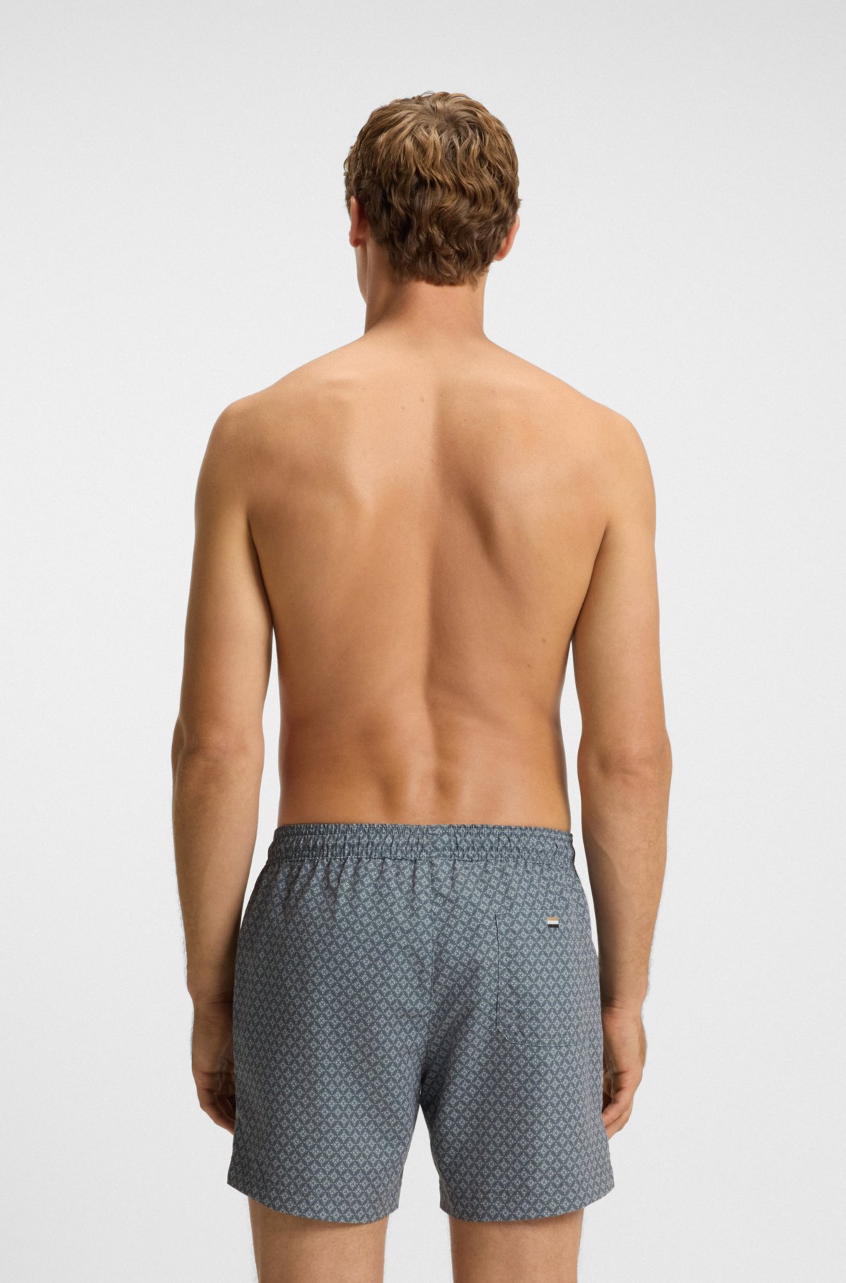 Micro-print swim trunks with logo patch